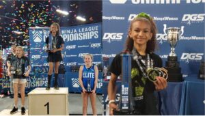 10-year-old Canadian girl competing in a ninja obstacle course during a Canadian Ninja League event.